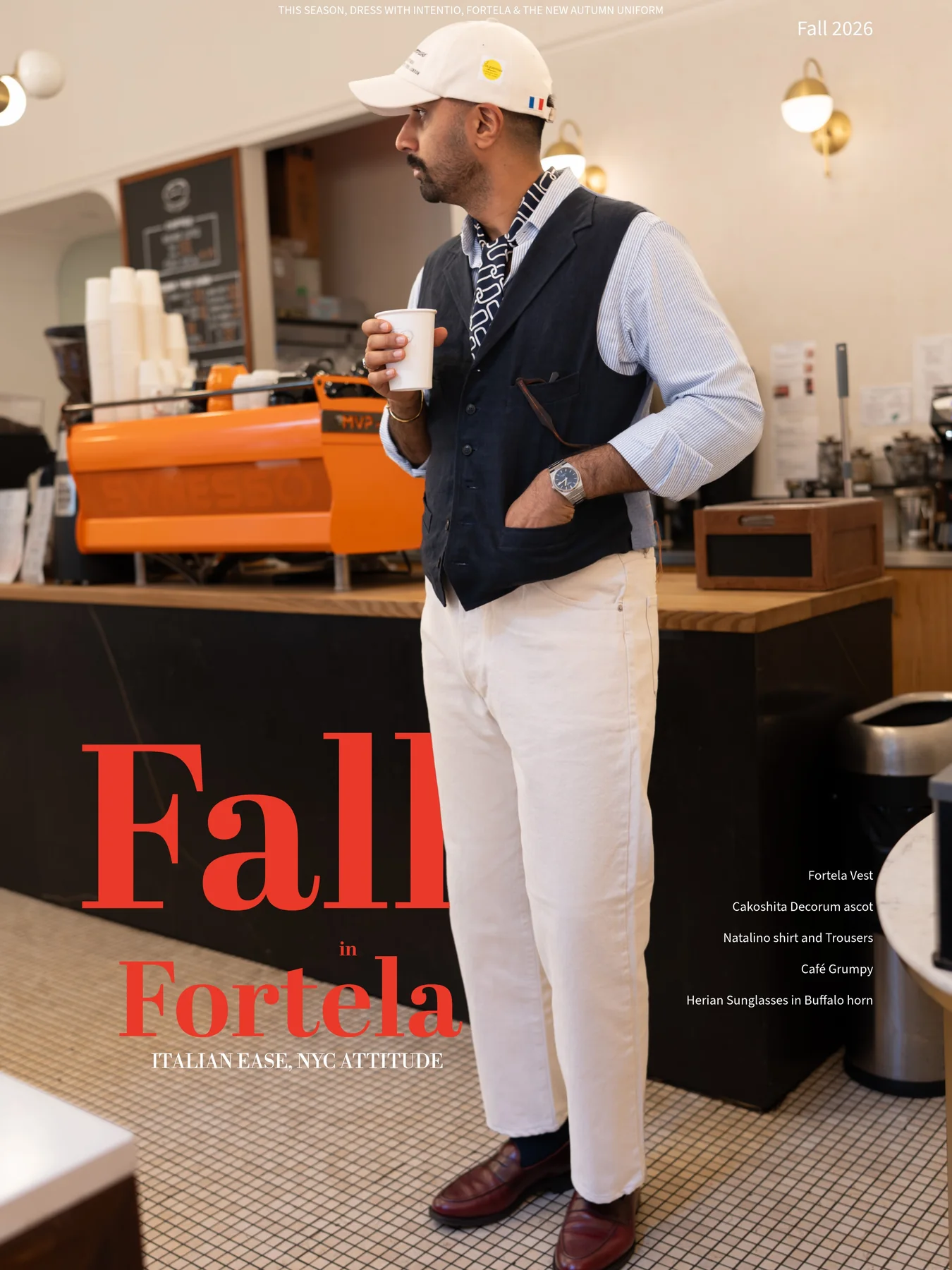 A navy linen vest and ecru trouser look styled in a New York café